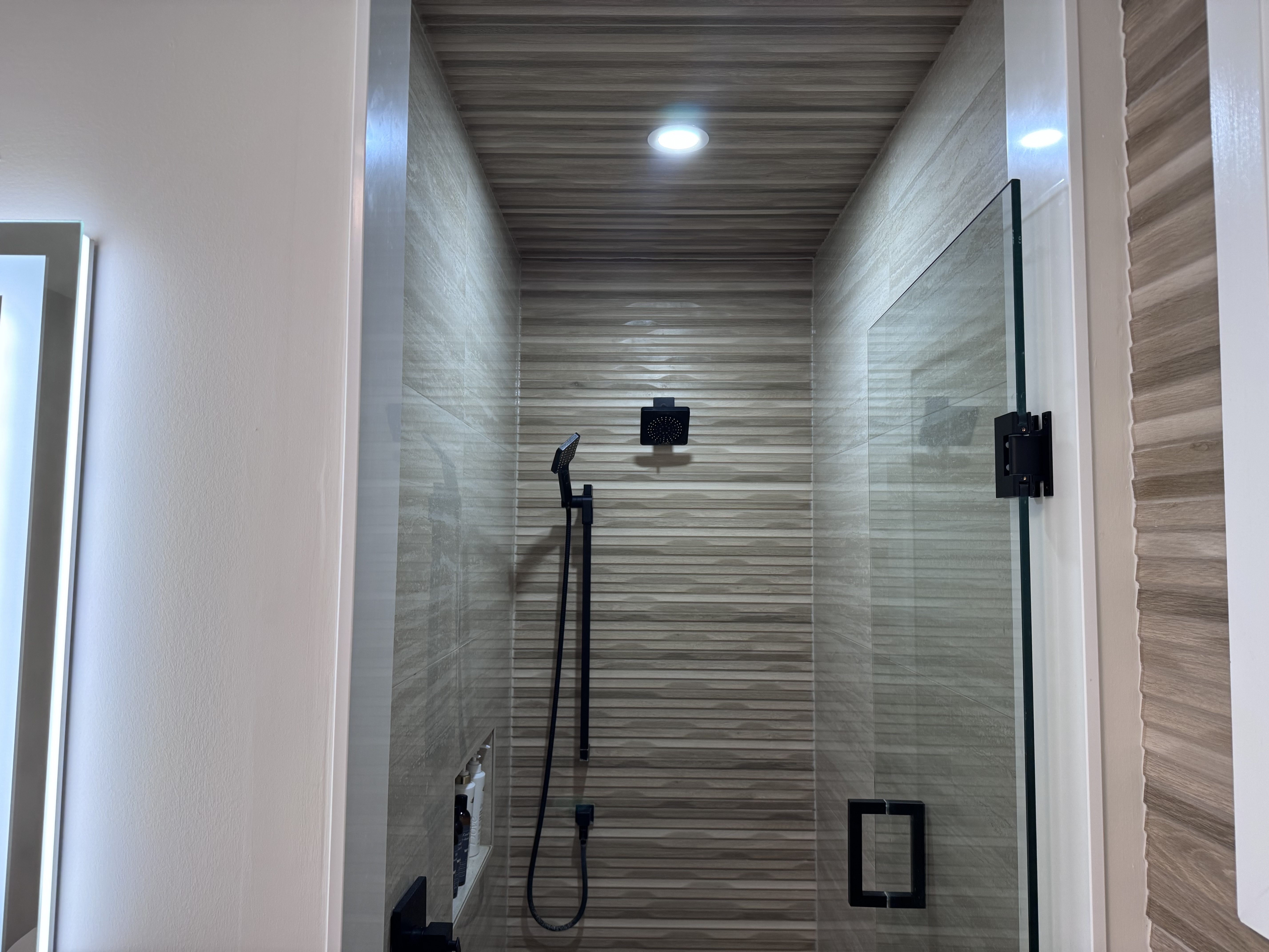 Custom walk-in shower with floor-to-ceiling tile