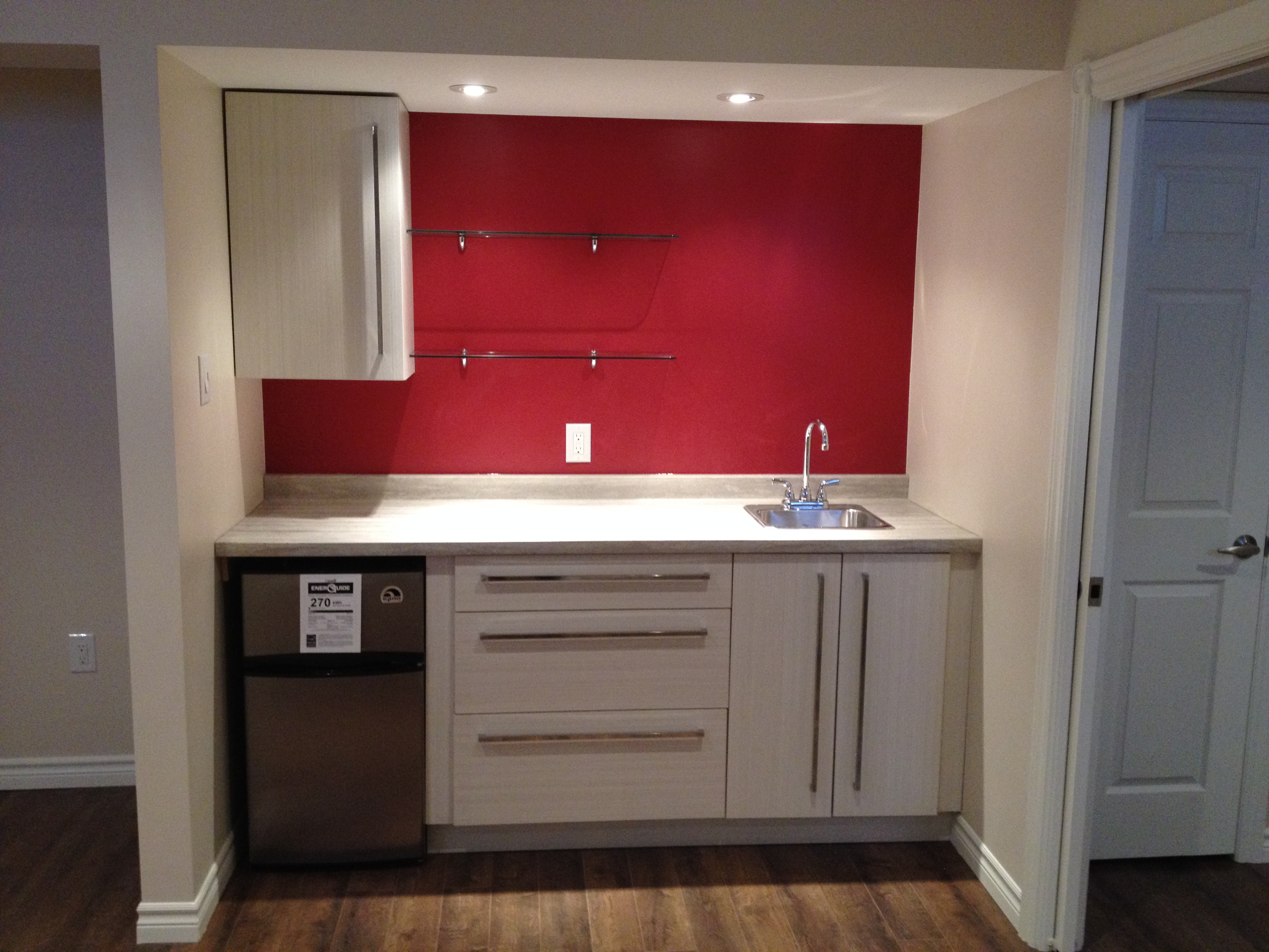 Basement wet bar with custom cabinetry