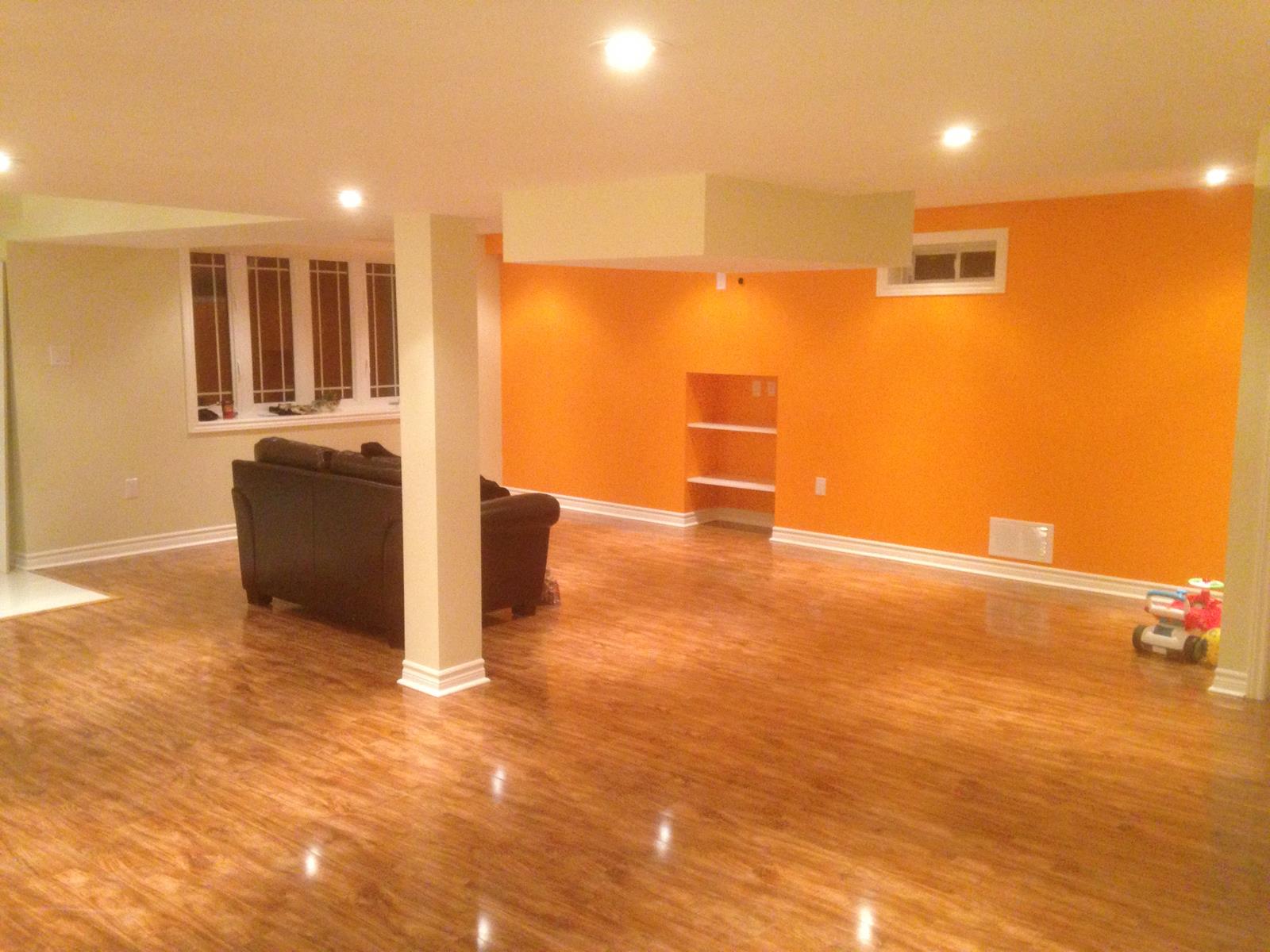Finished basement with accent wall